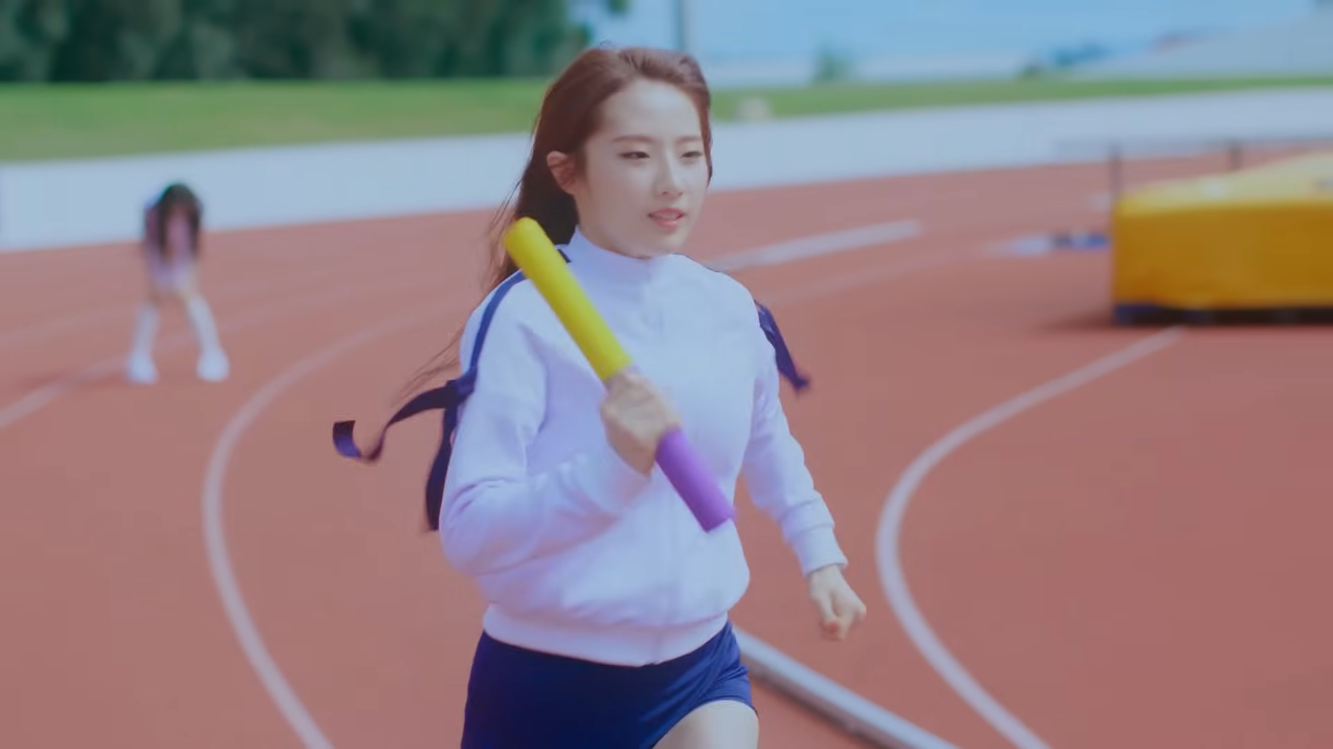 Haseul running on the track.